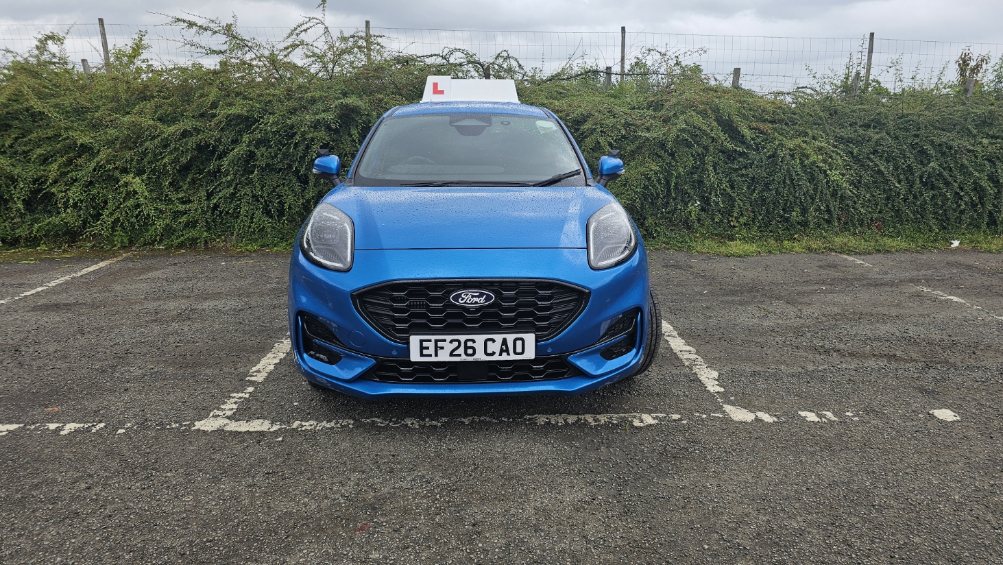 Ford Puma manual driving school car with learner roof sign