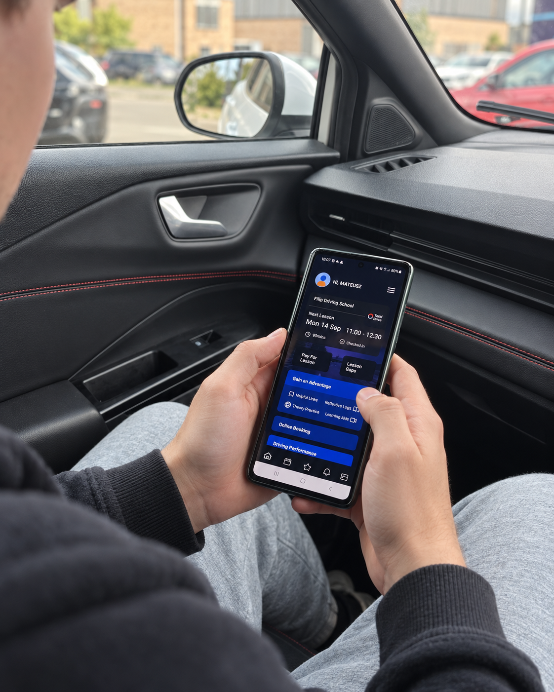 Pupil using the Total Drive app from the passenger seat before a driving lesson
